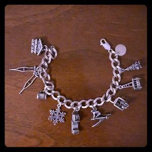 Sterling silver ski winter themed charm bracelet.